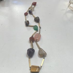 Polished beautiful stones, separated by gold, half inch lenders